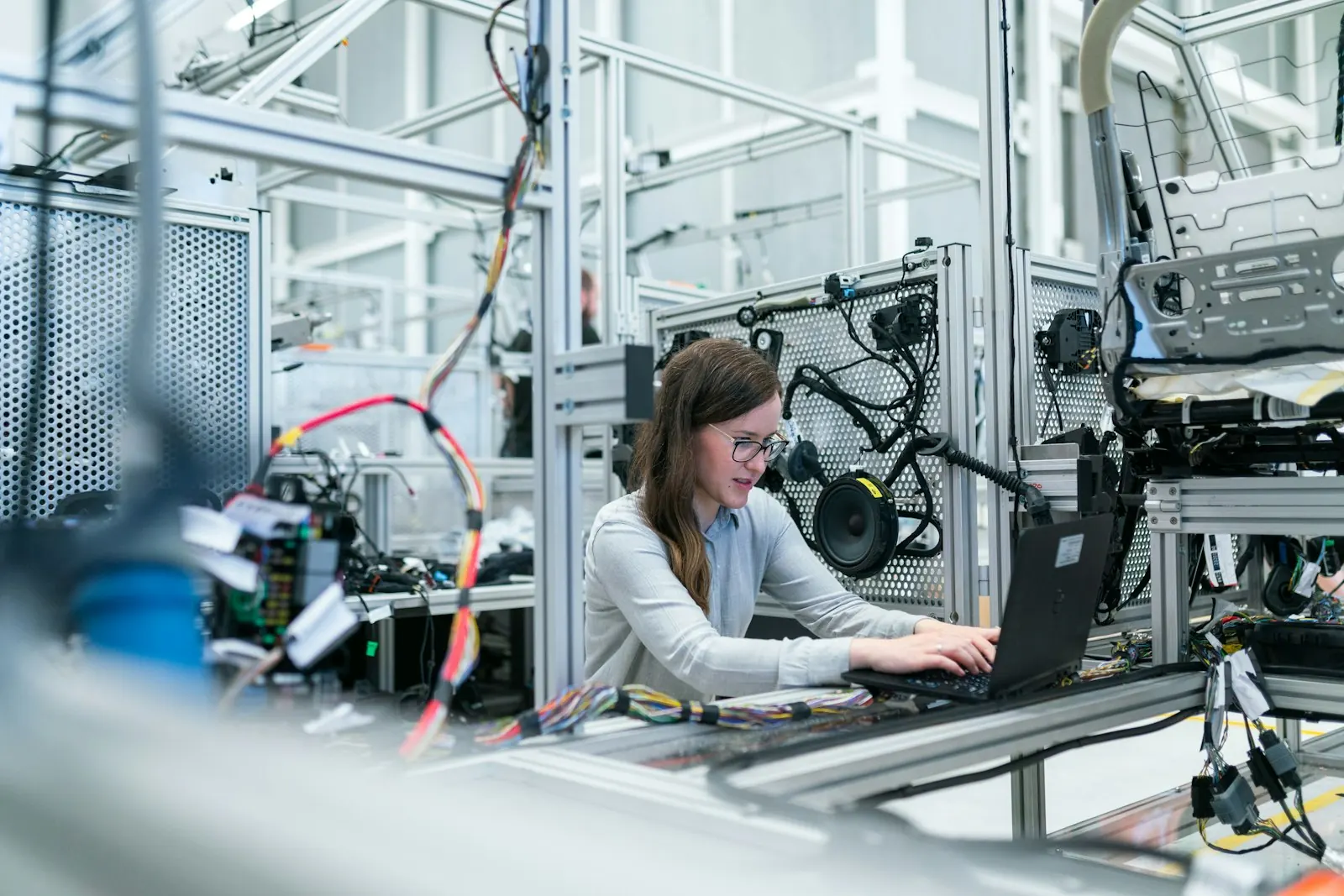 Operations specialist reviewing supply chain performance on a laptop