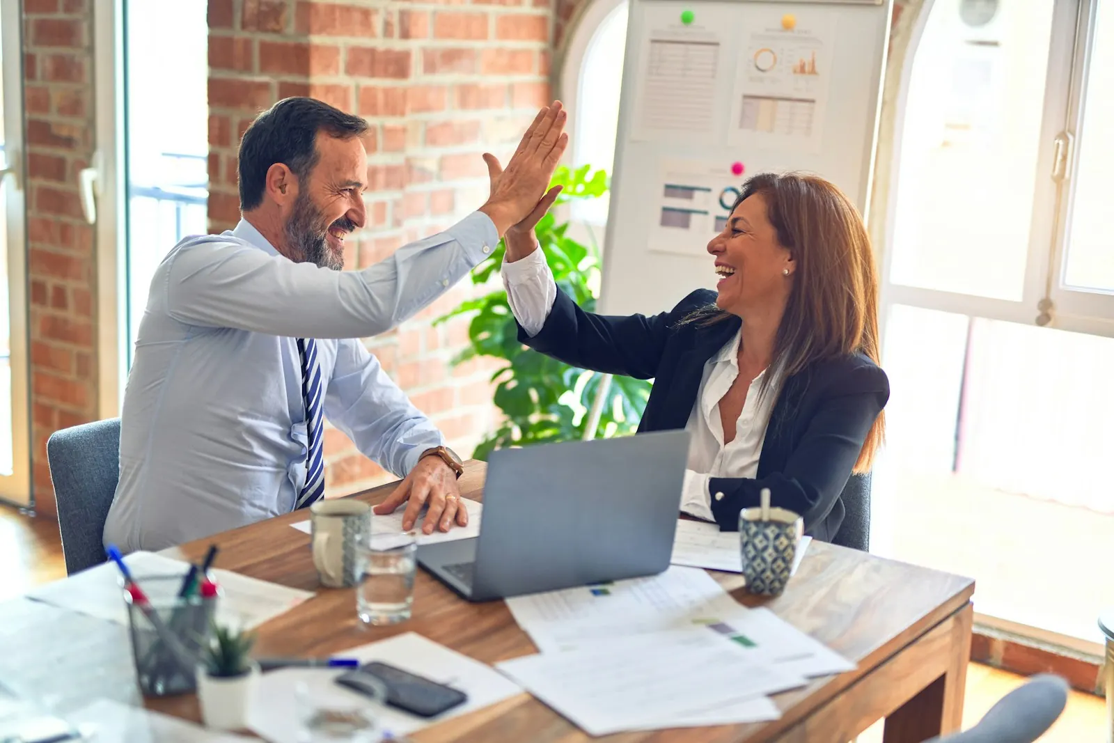 Two business teams meeting to agree supplier terms
